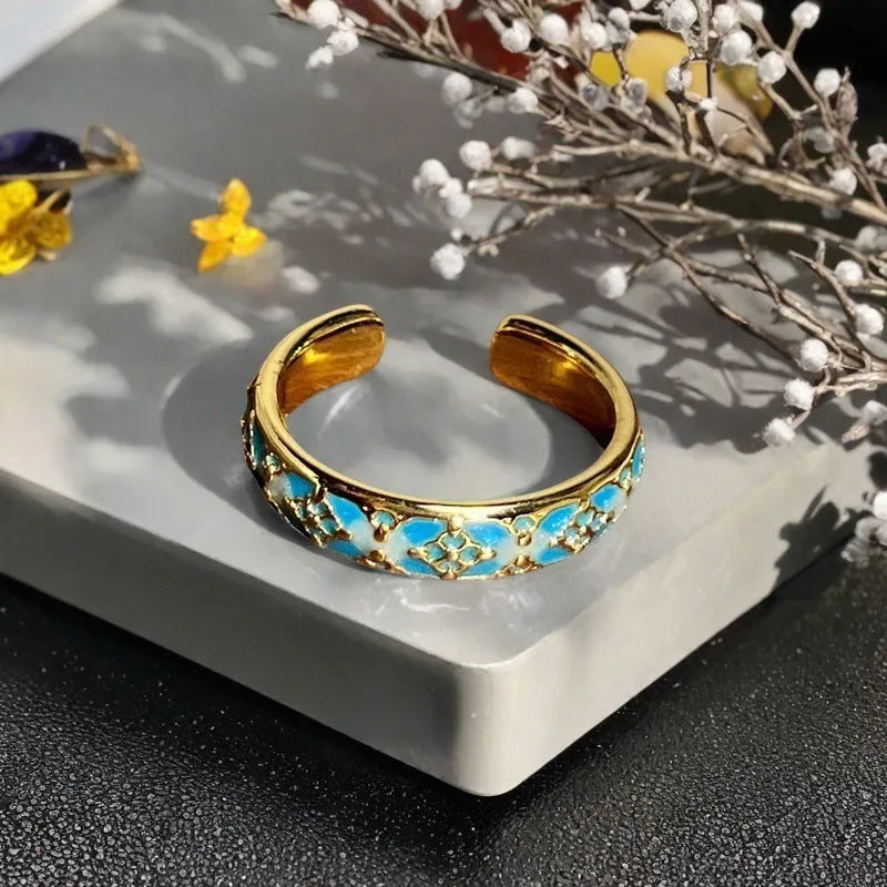 Adjustable copper gourd ring with flower and bow design in New Chinese style featuring inlaid zircon stones