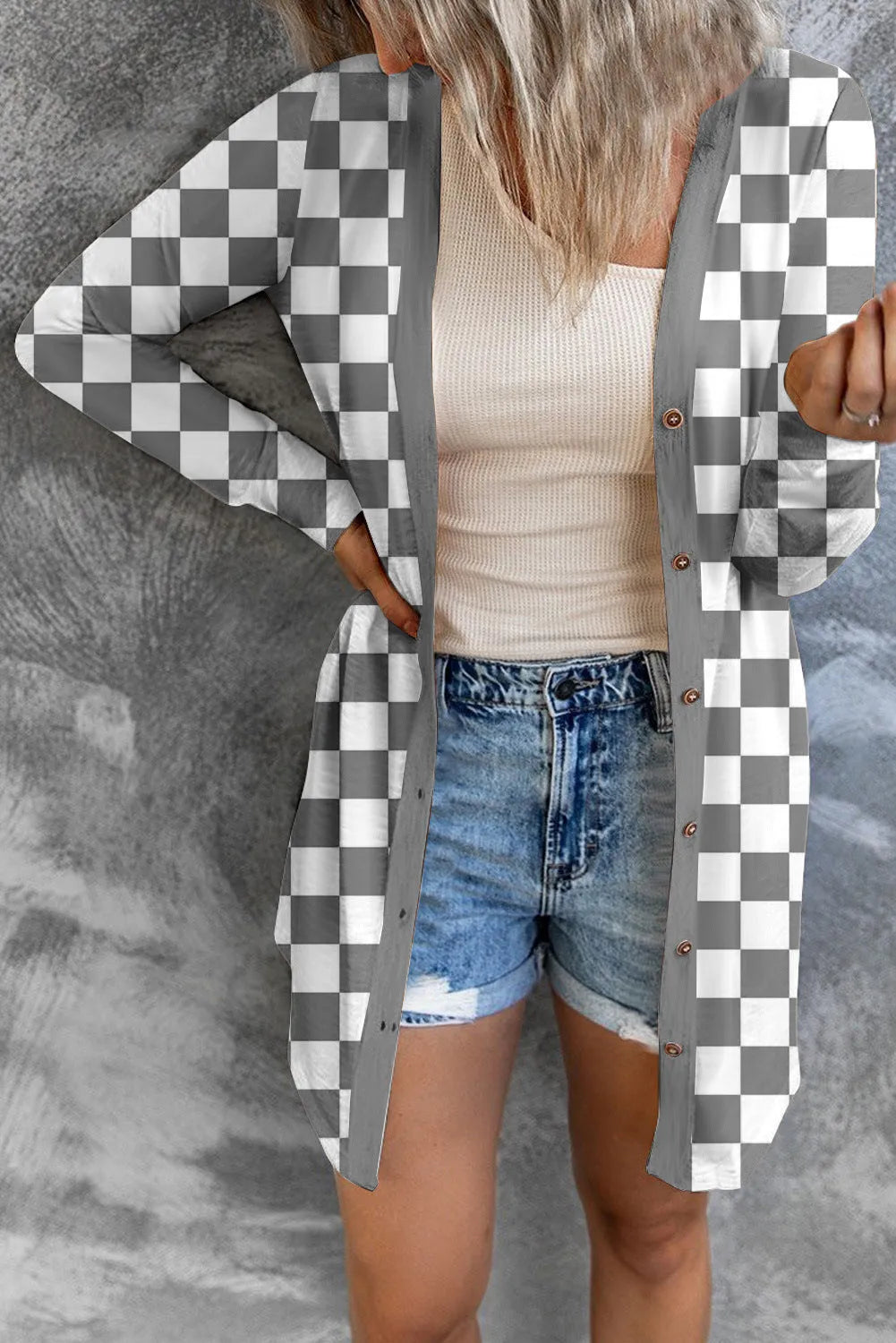 Women's long grey plaid knitted cardigan coat with regular sleeves on a hanger