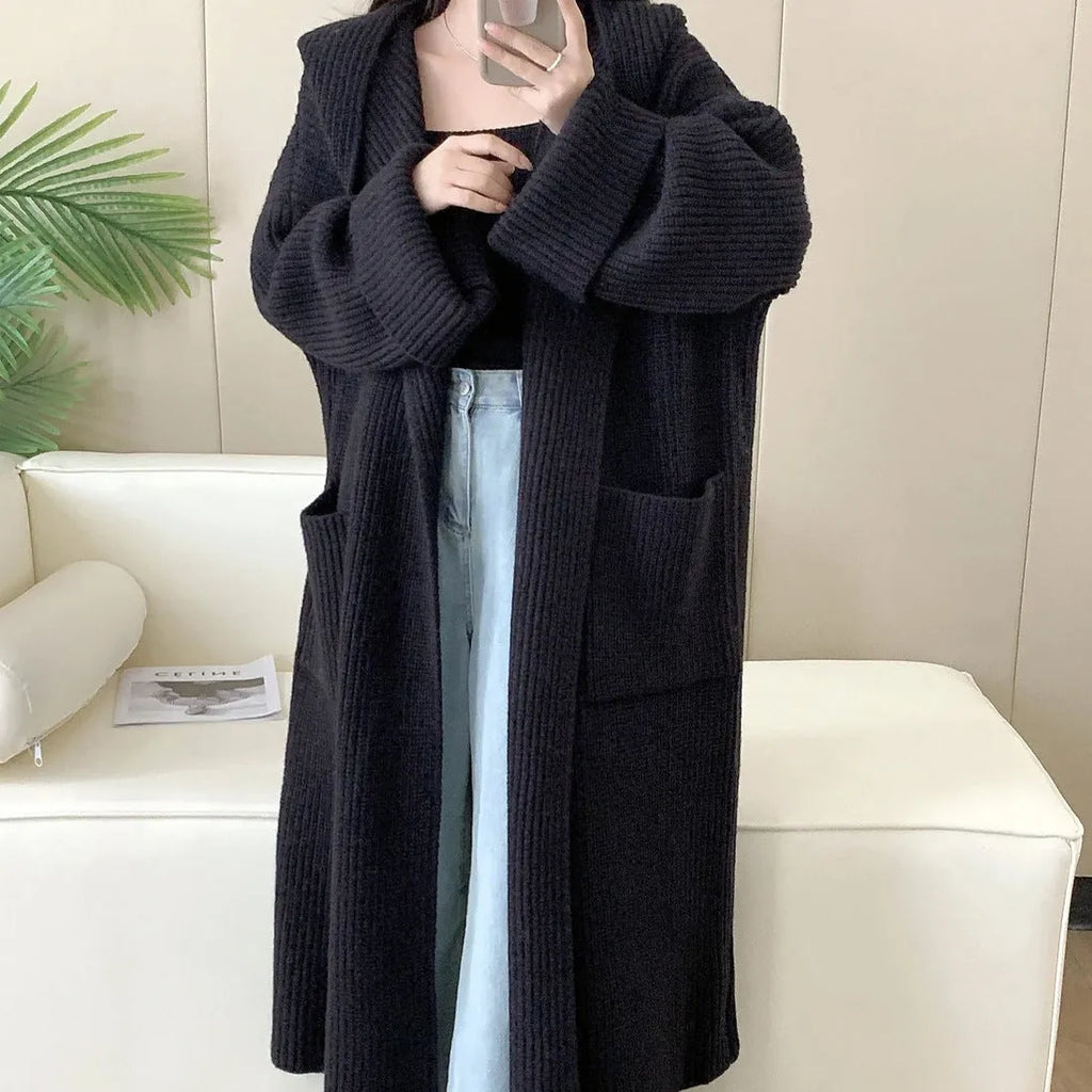 Loose hooded acrylic cardigan sweatshirt in milky white colour showing raglan sleeves and 80cm length