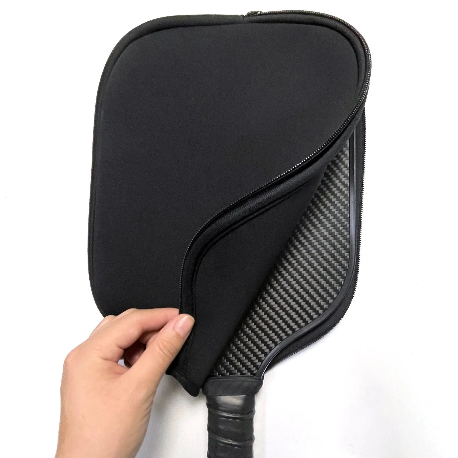 Black neoprene protective sleeve for a table tennis racket showing texture and fit