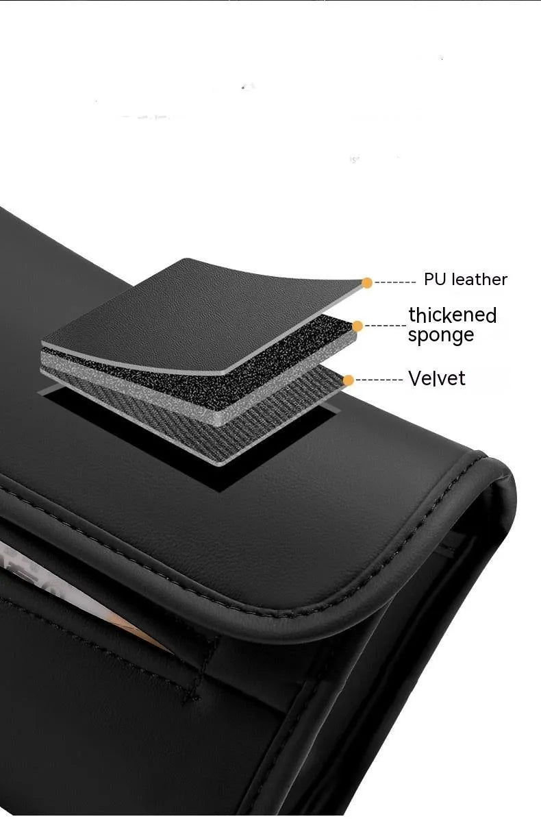 Leather car tissue box mounted on a car sun visor with elastic band strap.