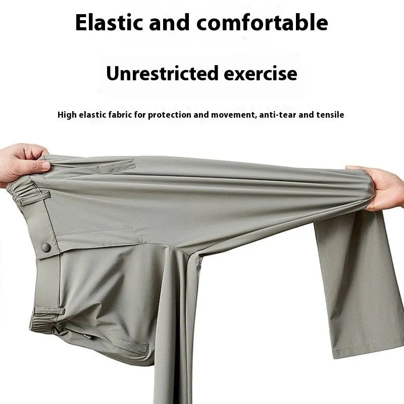 Man wearing black Ice Silk straight-leg loose trousers with an elasticated waist for leisure.
