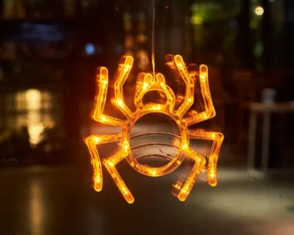 Halloween window hanging LED lights with seven designs including spider, pumpkin, ghost, and bat motifs