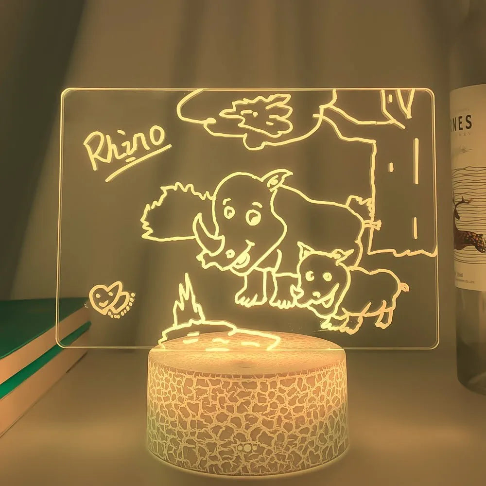 3D acrylic message board lamp with handwritten text glowing in colour, featuring a black touch base and remote control