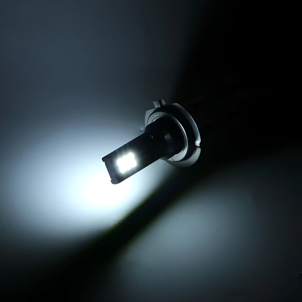 H7 110W LED fog light bulb with white aluminium housing and 12 SMD LEDs visible.