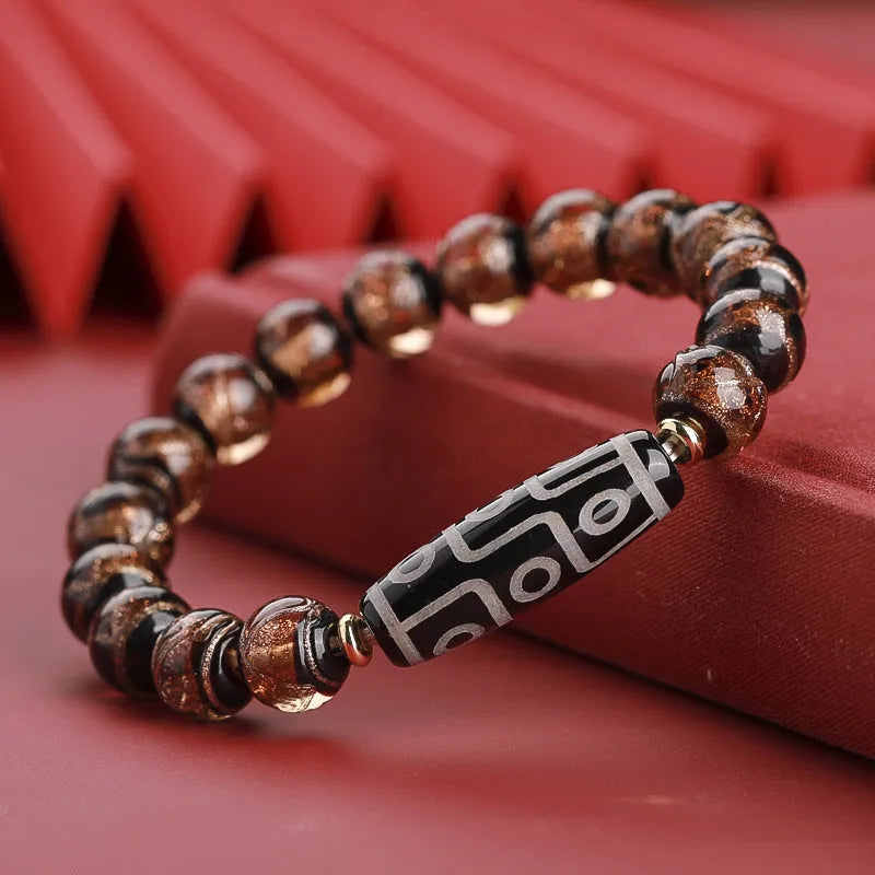 Chinese-style bracelet with colourful glazed beads showing snake patterns, available in 10mm 12mm or 14mm sizes