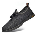 Men's black breathable mesh casual shoes with elastic band and rubber sole.