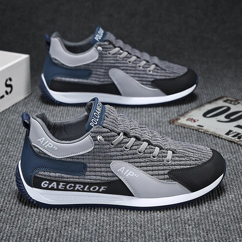 Men's low-top green mesh running shoes with white laces on a grey sole