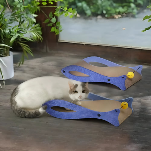 Blue fish-shaped cat scratcher pad with corrugated cardboard surface, ball toys, and wavy lounge area.