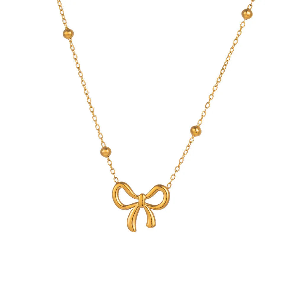 Gold titanium steel bow necklace on cross chain, adjustable 41-50 cm, for women's fashion
