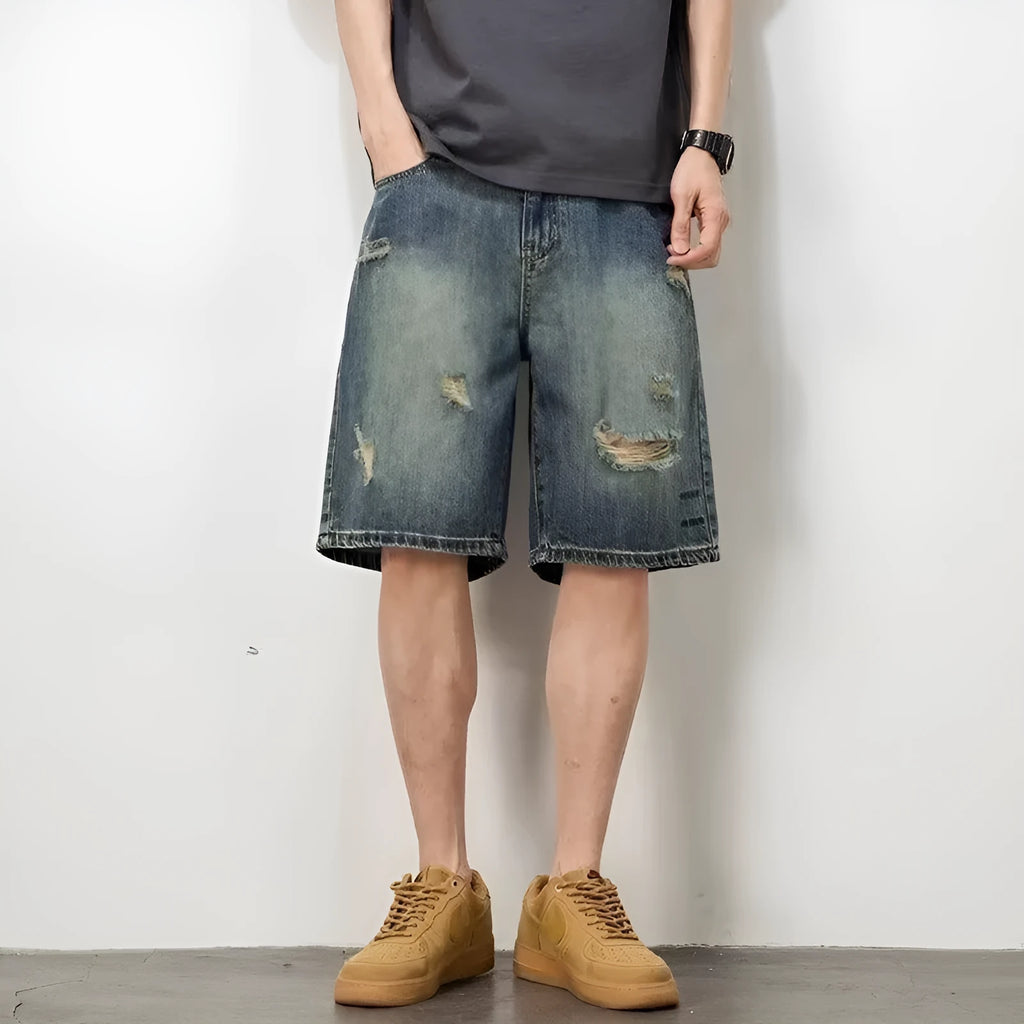 Blue retro denim men's shorts with distressed holes and straight leg cut