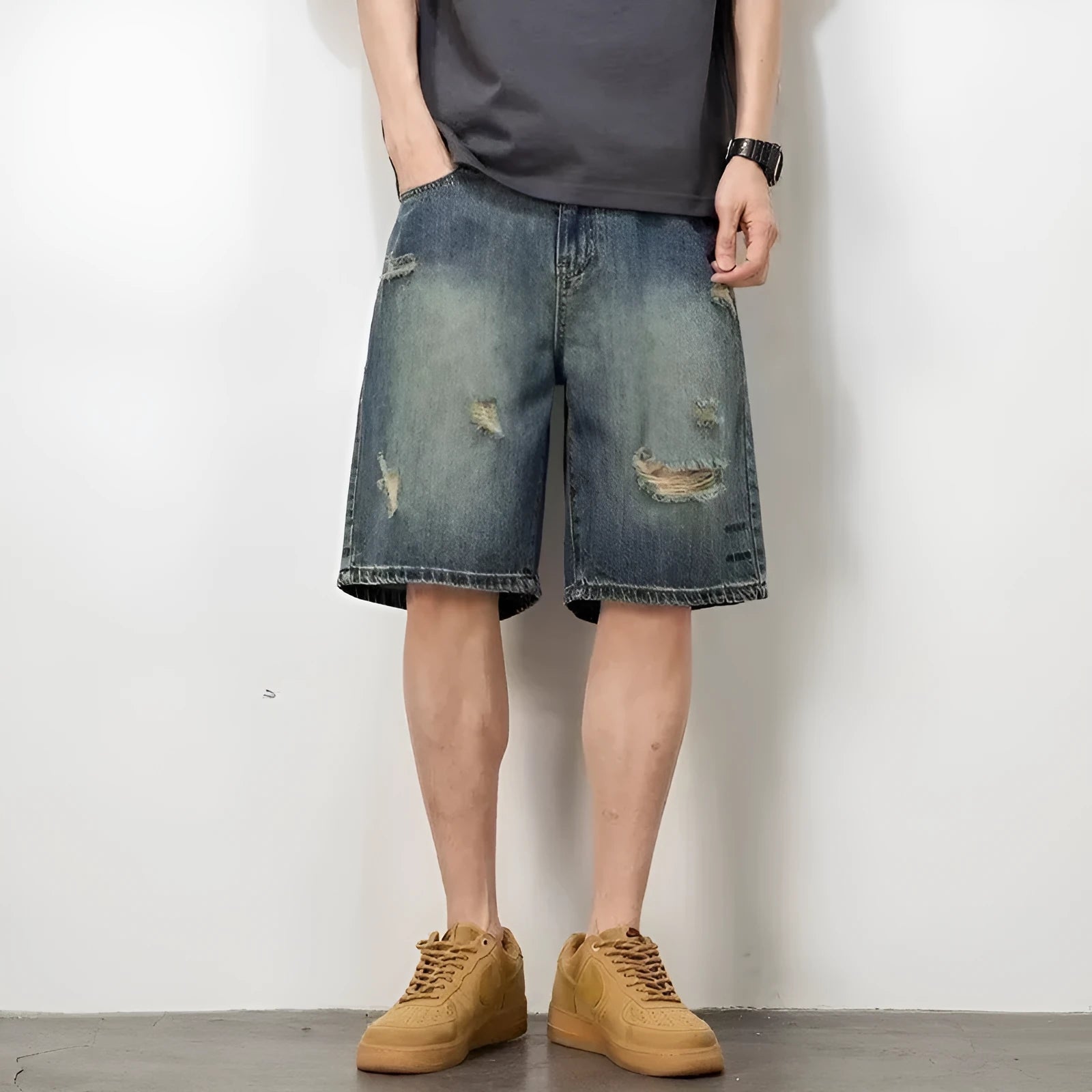 Blue retro denim men's shorts with distressed holes and straight leg cut