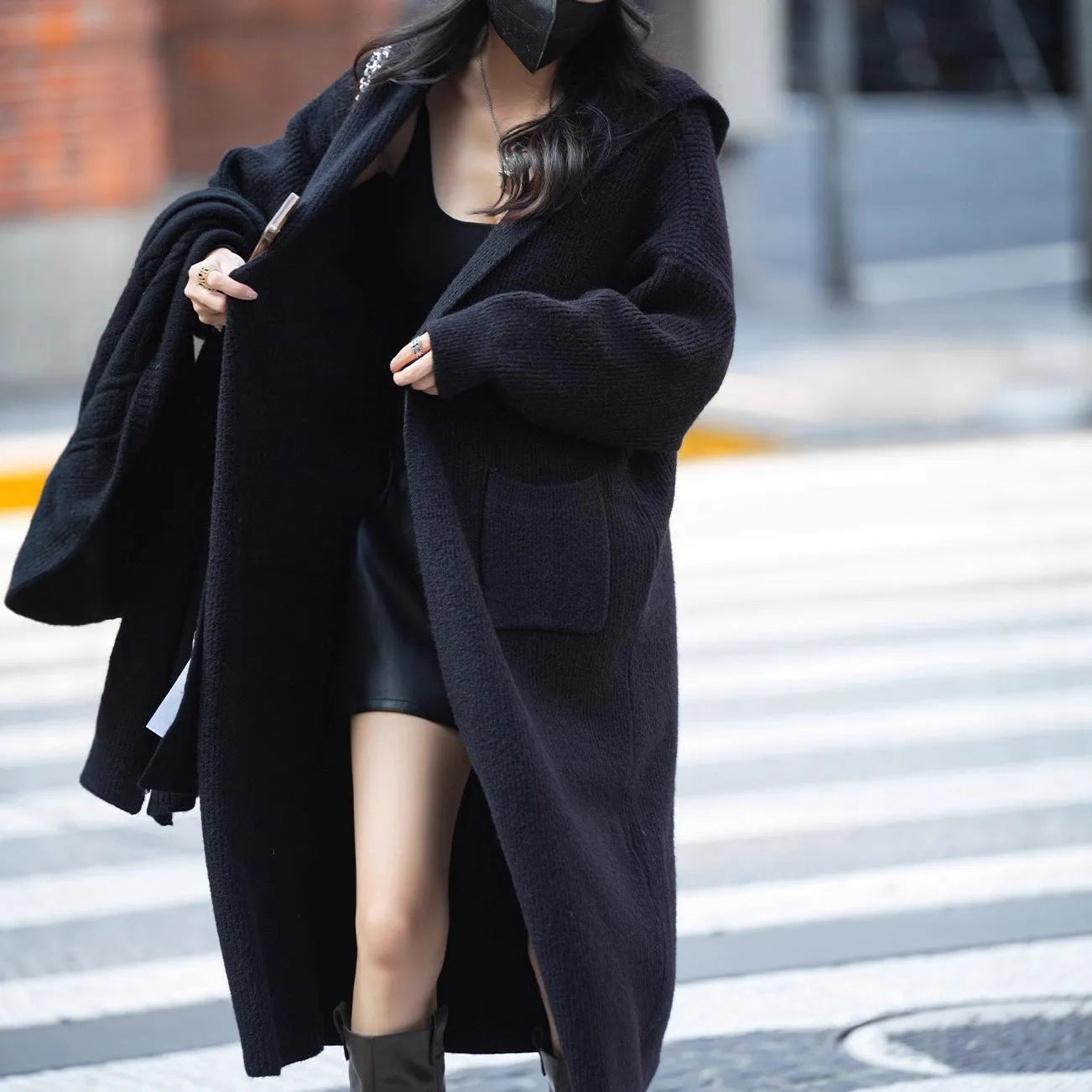 Long gray knitted hooded cardigan trench coat on a model, showing loose fit and 80 cm length.