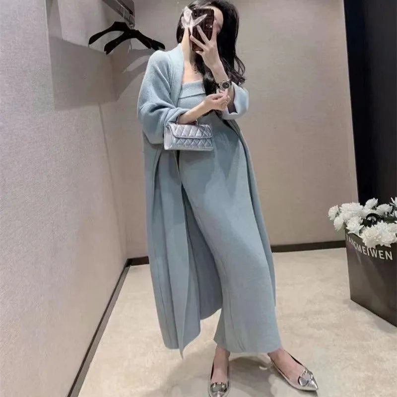 Women's grey knitted cardigan dress suit with matching coat, showing flocked pattern detail.