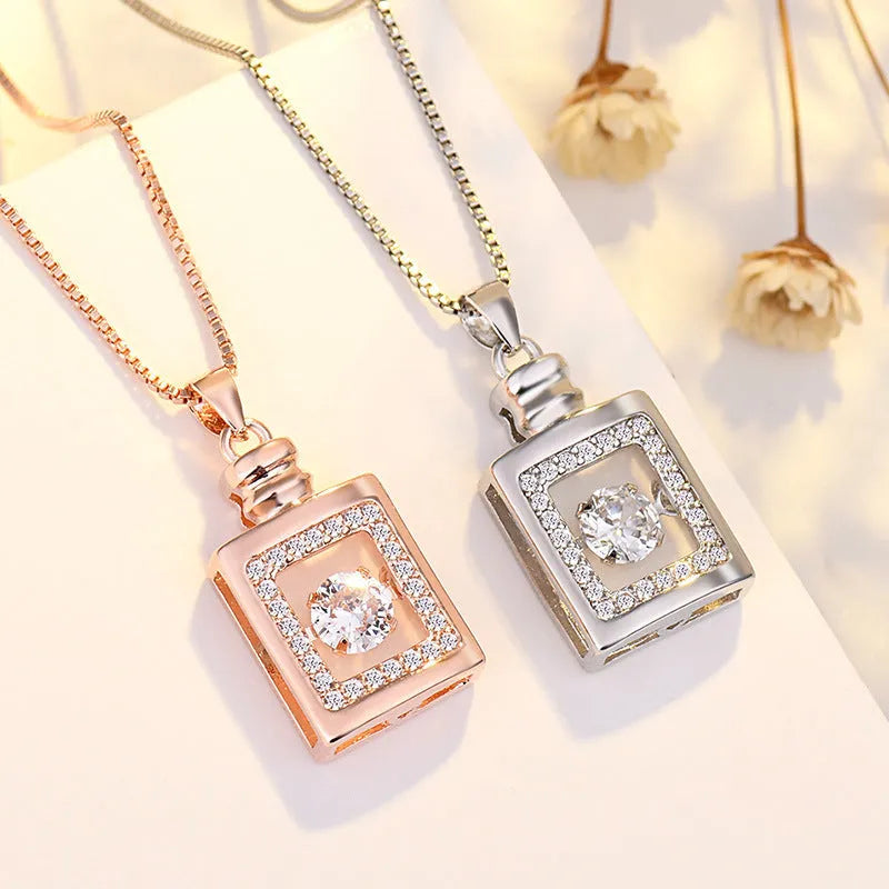 Sterling silver plated heart necklace pendant with crown and bow details in rose gold or silver colour