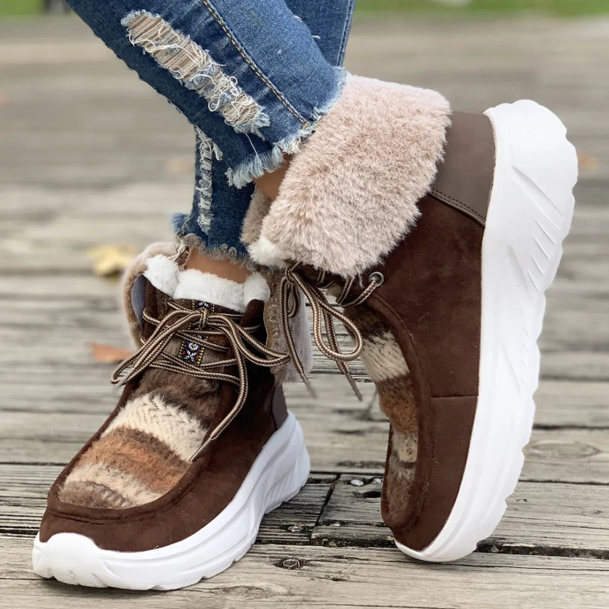 Women's lace-up snow boots with suede upper, plush lining, and platform sole