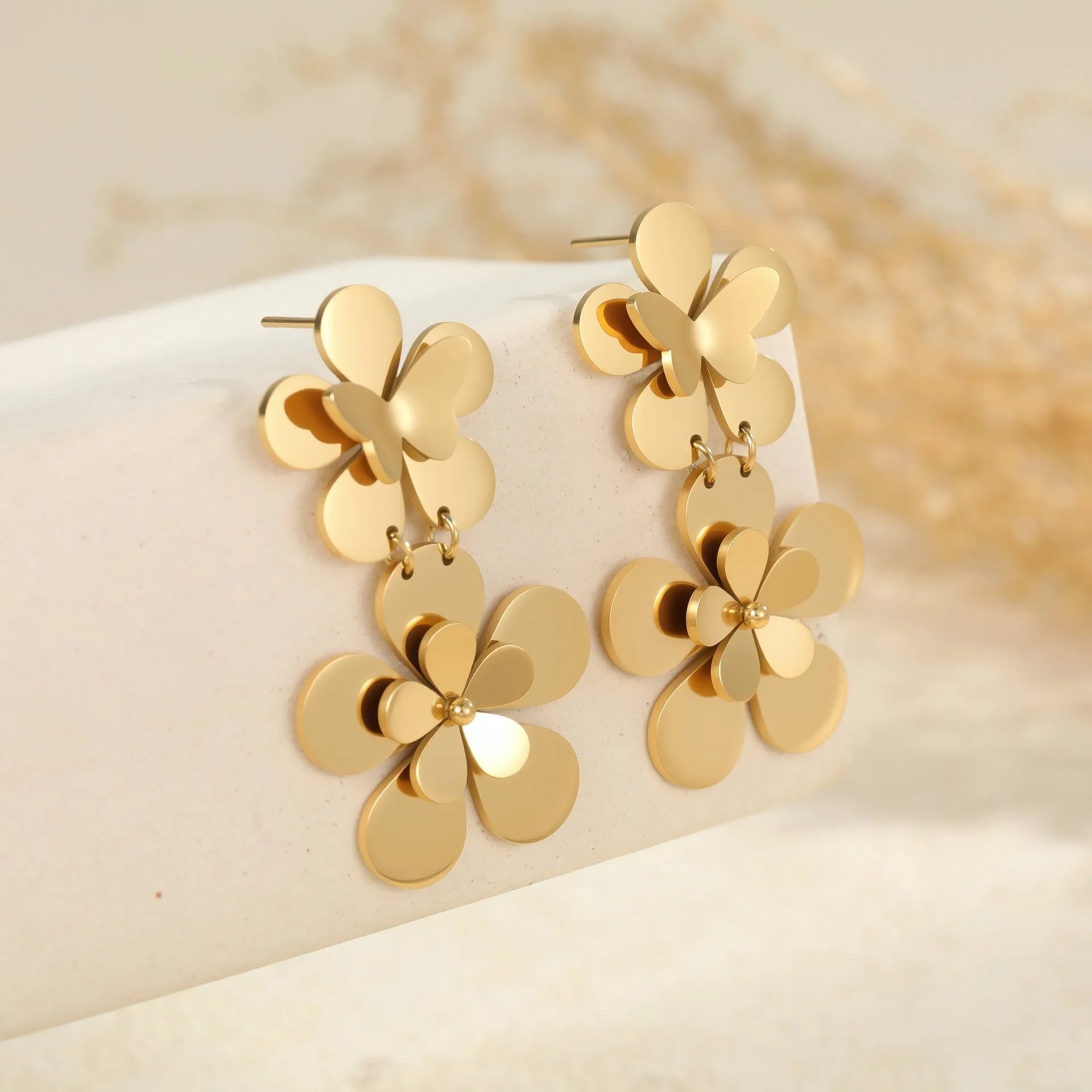 Gold-coloured stainless steel earrings with flower and butterfly design for women