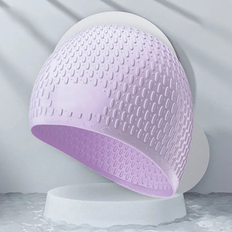 Silicone water drop design swimming cap for adults shown in various colours.