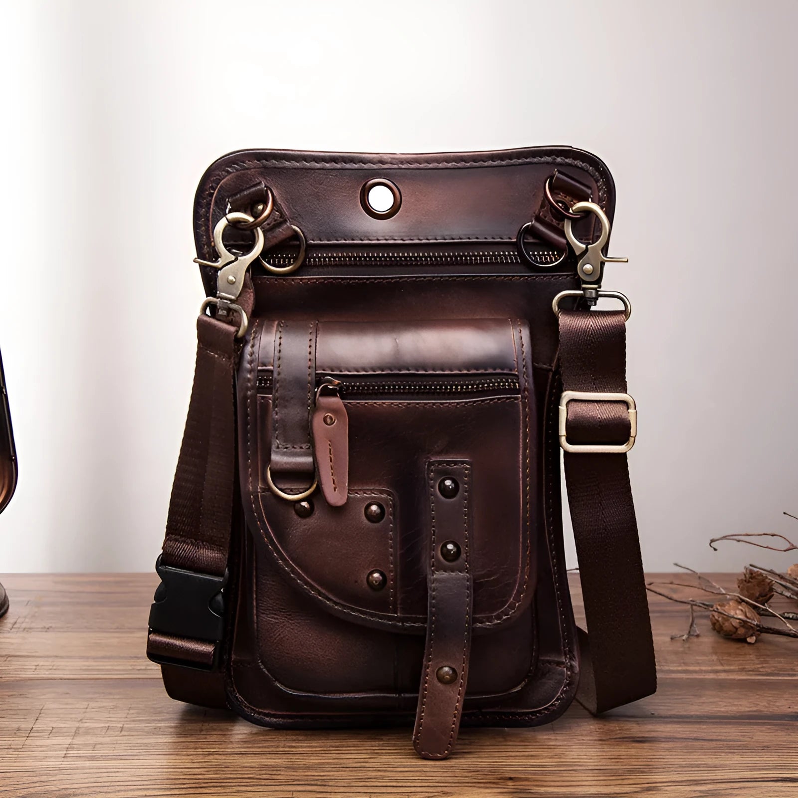 Men's black genuine cowhide leather punk-style fanny pack worn on the waist.