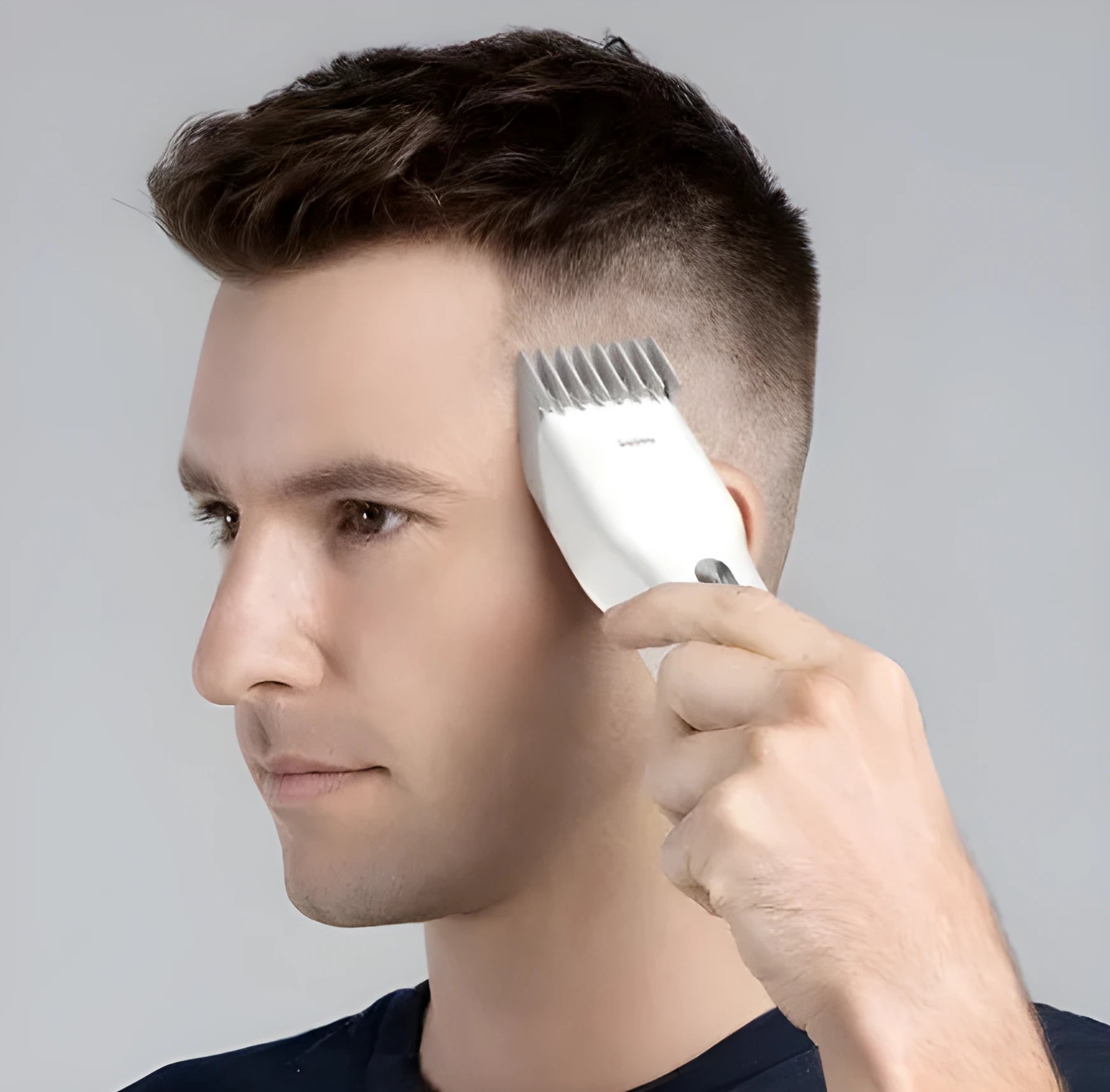 Black and white cordless hair clippers with ceramic blade and adjustable slider comb