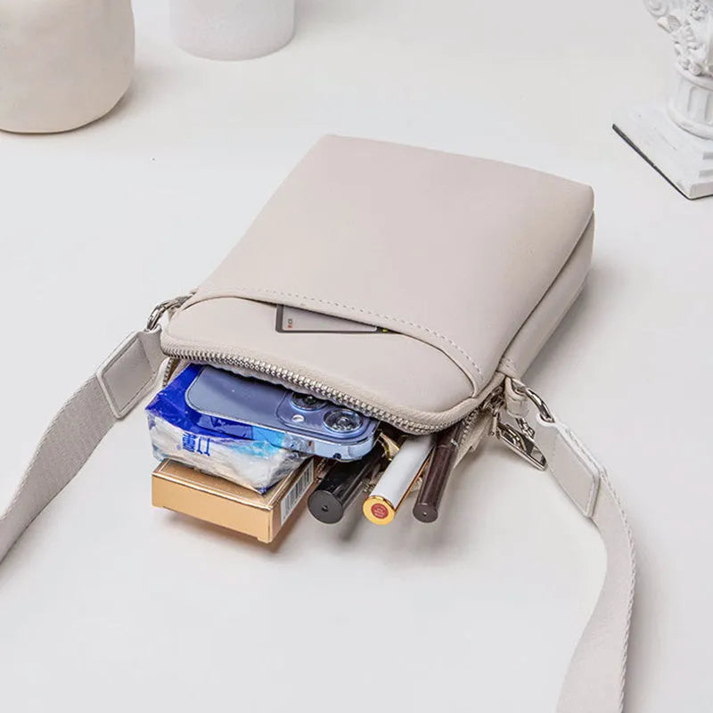 Small solid-colour PU crossbody shoulder bag for mobile phone.