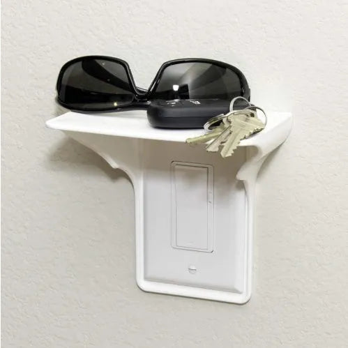 White plastic socket organiser rack for tool storage on a workbench.