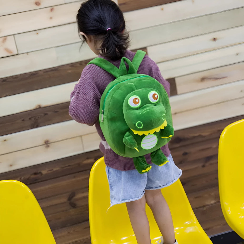 Dinosaur plush toy backpack for children with embroidery detailing and soft handle in blue colour