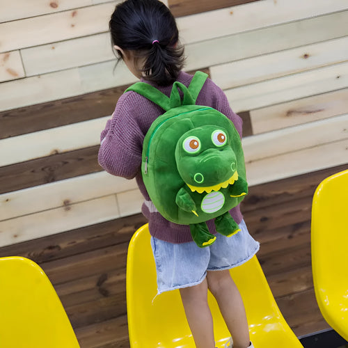 Dinosaur plush toy backpack for children with embroidery detailing and soft handle in blue colour