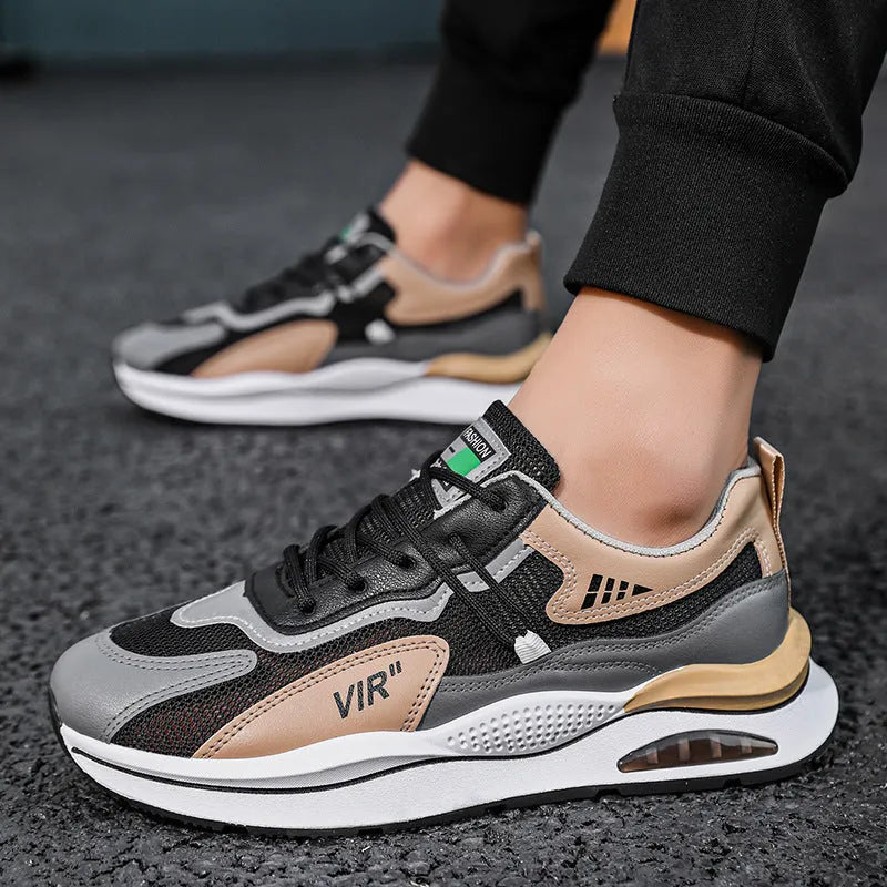Men's gray and black mesh running shoes with a round toe and middle-top design on a white background.