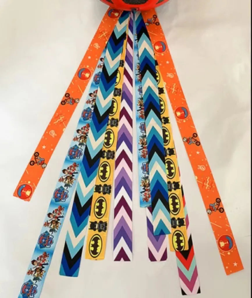 Children's decorative helmet streamer ribbon in multiple colours for roller skating and skiing safety gear.