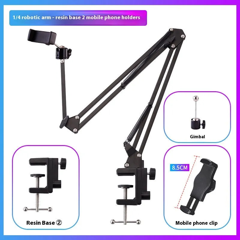 Black foldable metal cantilever bracket holding a tablet on a desktop, showing adjustable arms and clamp.