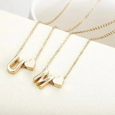 Peach heart shaped alloy letter pendant necklace on chain in gold colour