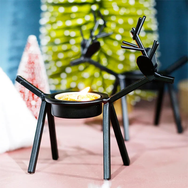 Black iron Christmas candlestick holder with creative elk bracket design for table decoration.