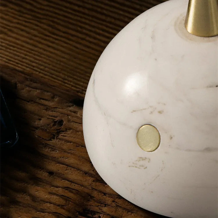 White desk lamp with glass shade and touch-sensitive dimmer switch.