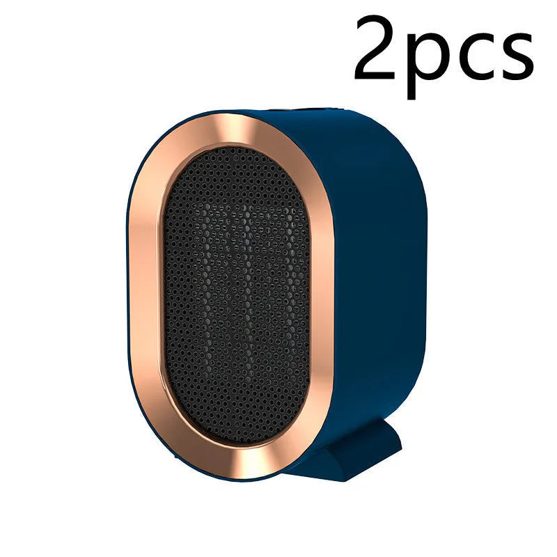 Desktop ceramic fan heater in black with mechanical control knobs and a front grille.