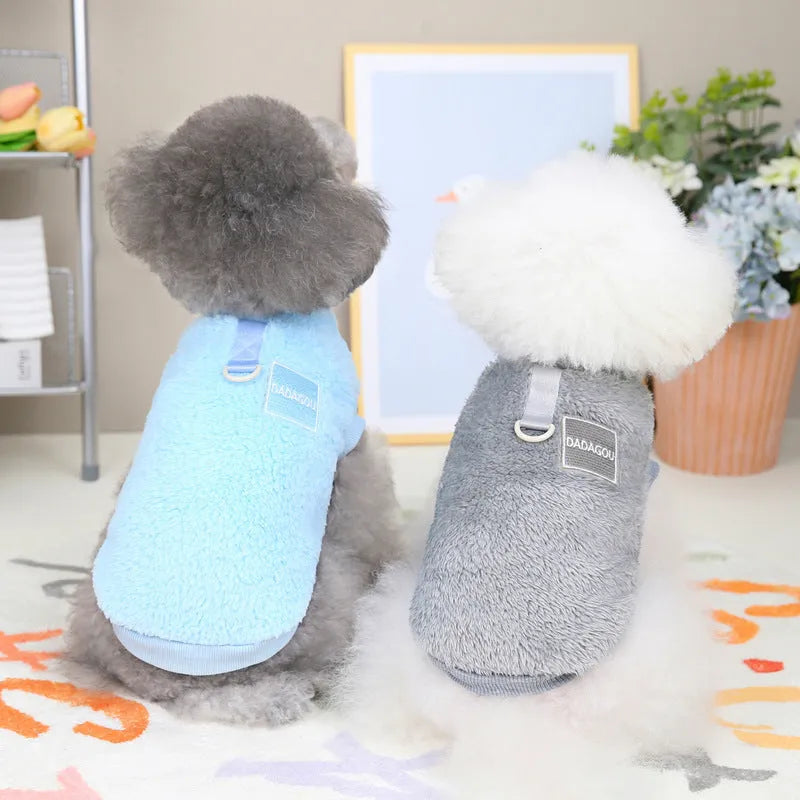 Blue coral fleece jacket for a dog, showing front leg openings and fluffy texture.