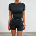 Women's solid colour viscose sports suit set with short-sleeve t-shirt and elastic shorts.