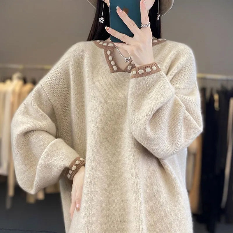 Women's camel coloured V-neck viscose pullover sweater with long sleeves on a hanger.