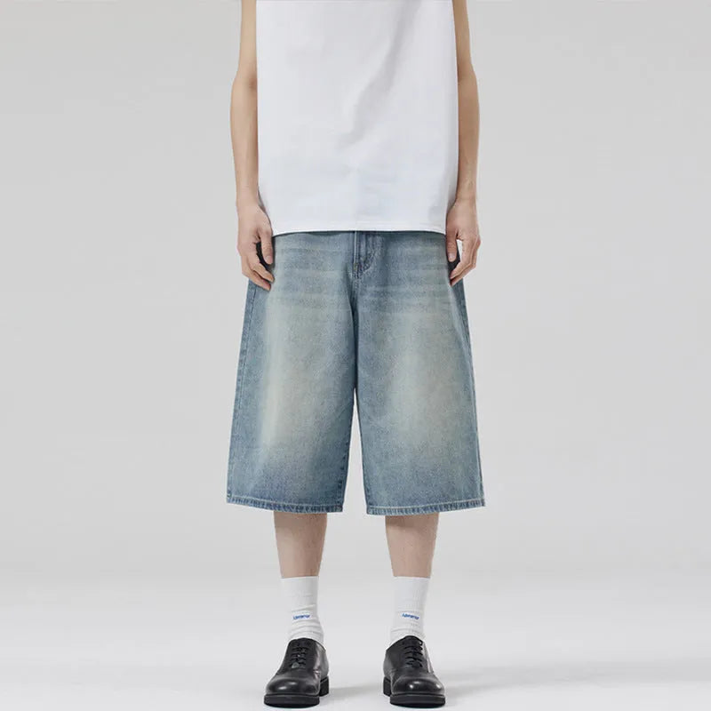 Men's light blue cotton denim shorts with a straight leg and cropped length on a hanger