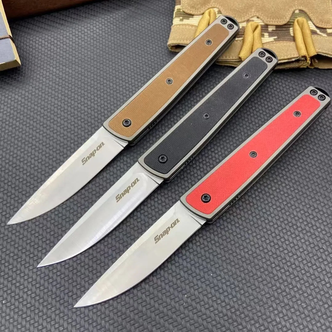 Folding fruit knife with stainless steel blade in black, brown, or red colour options showing closed and open positions
