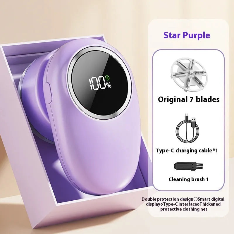 Beige and purple digital fur ball trimmer lint rollers with removable cutter heads on a table.