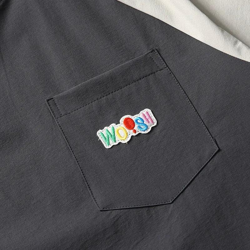 Dark grey men's loose fit T-shirt with contrast colour panels and raglan sleeves.