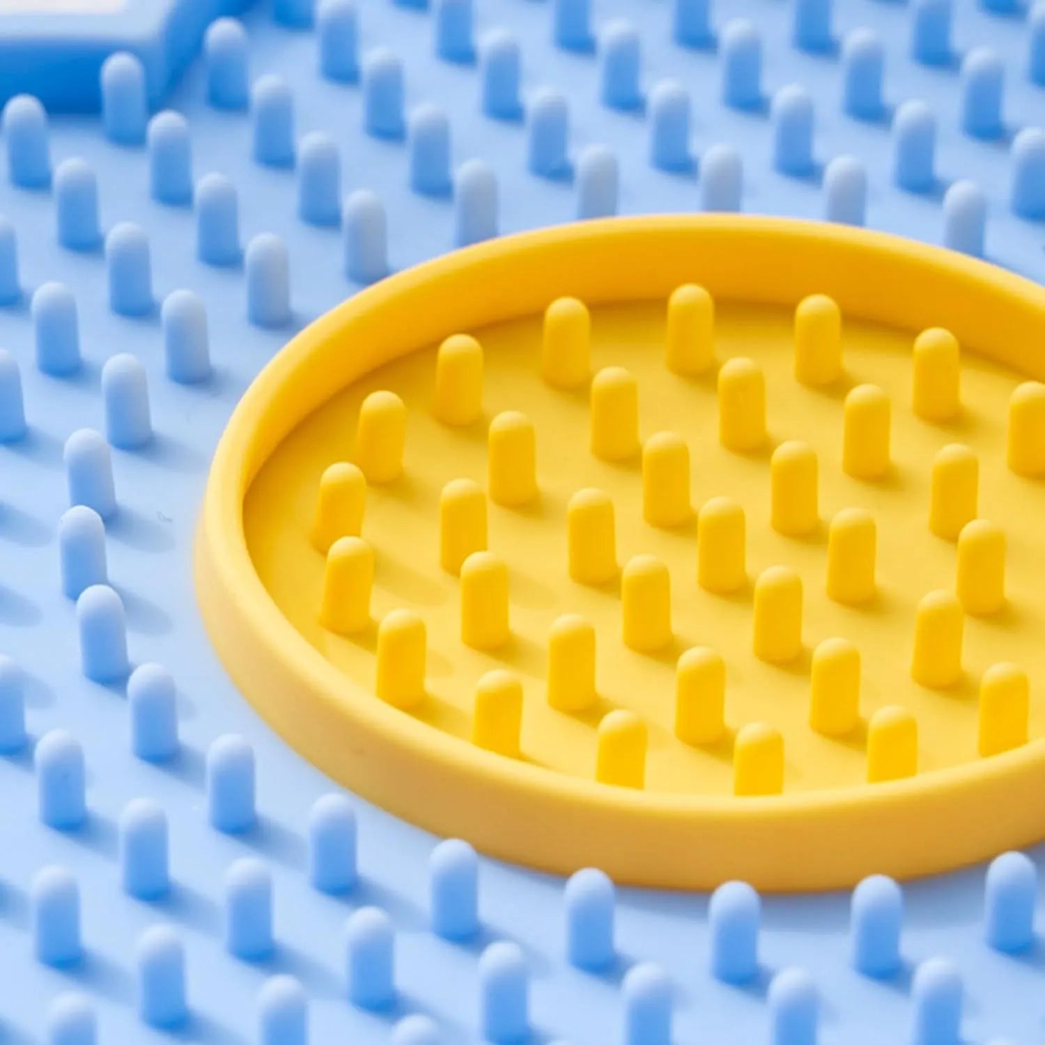 Flower-shaped silicone pet lick mat with suction cups in a choice of colours.
