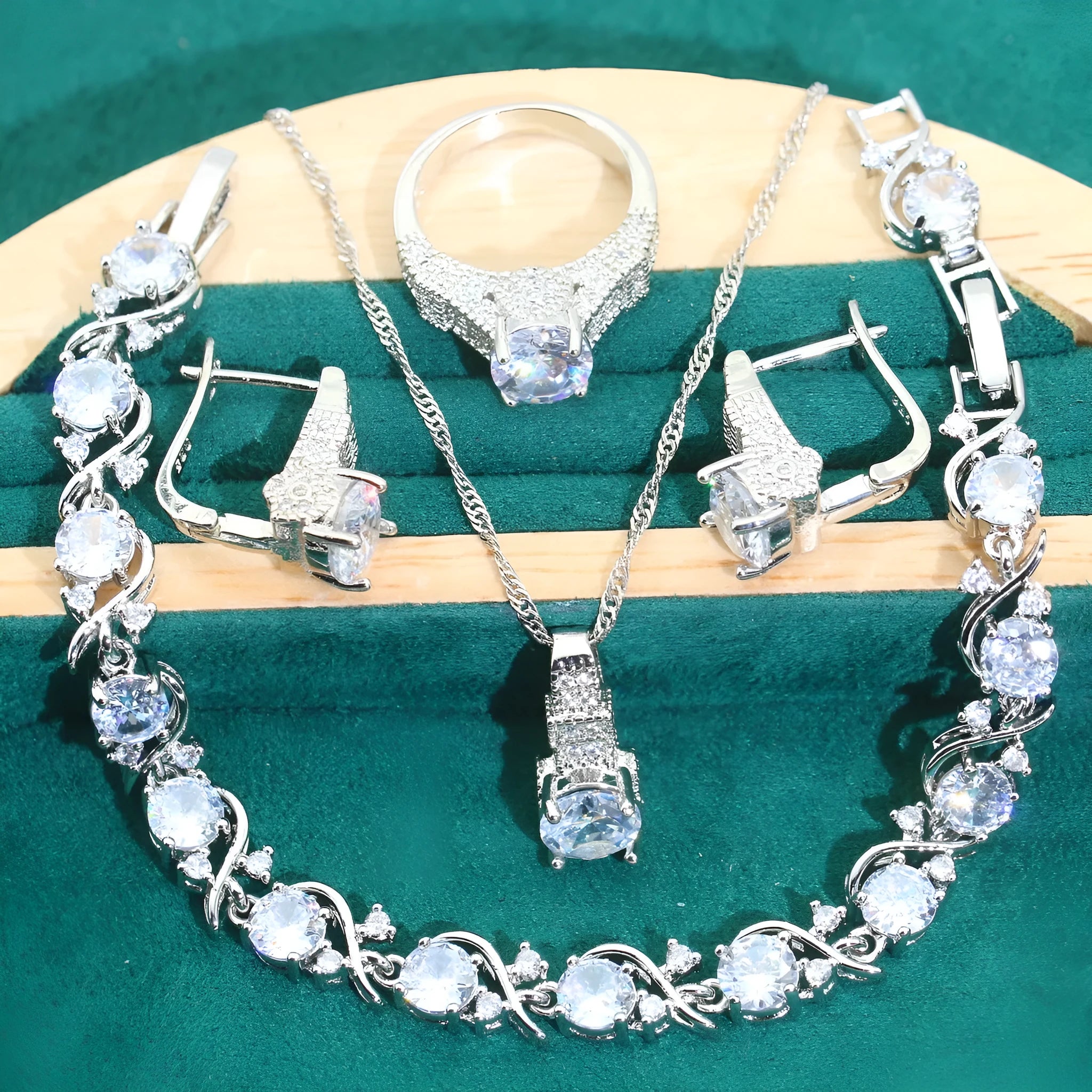 Four-piece bridal jewellery set with necklace, bracelet, earrings, and ring in alloy with zircon detail
