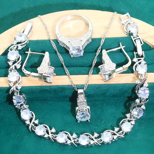 Four-piece bridal jewellery set with necklace, bracelet, earrings, and ring in alloy with zircon detail