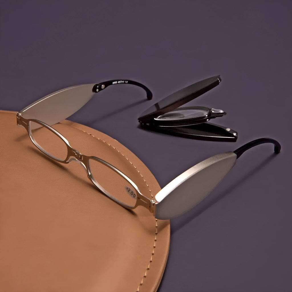 Folding pocket presbyopic glasses in black and silver retro frames with ring detailing