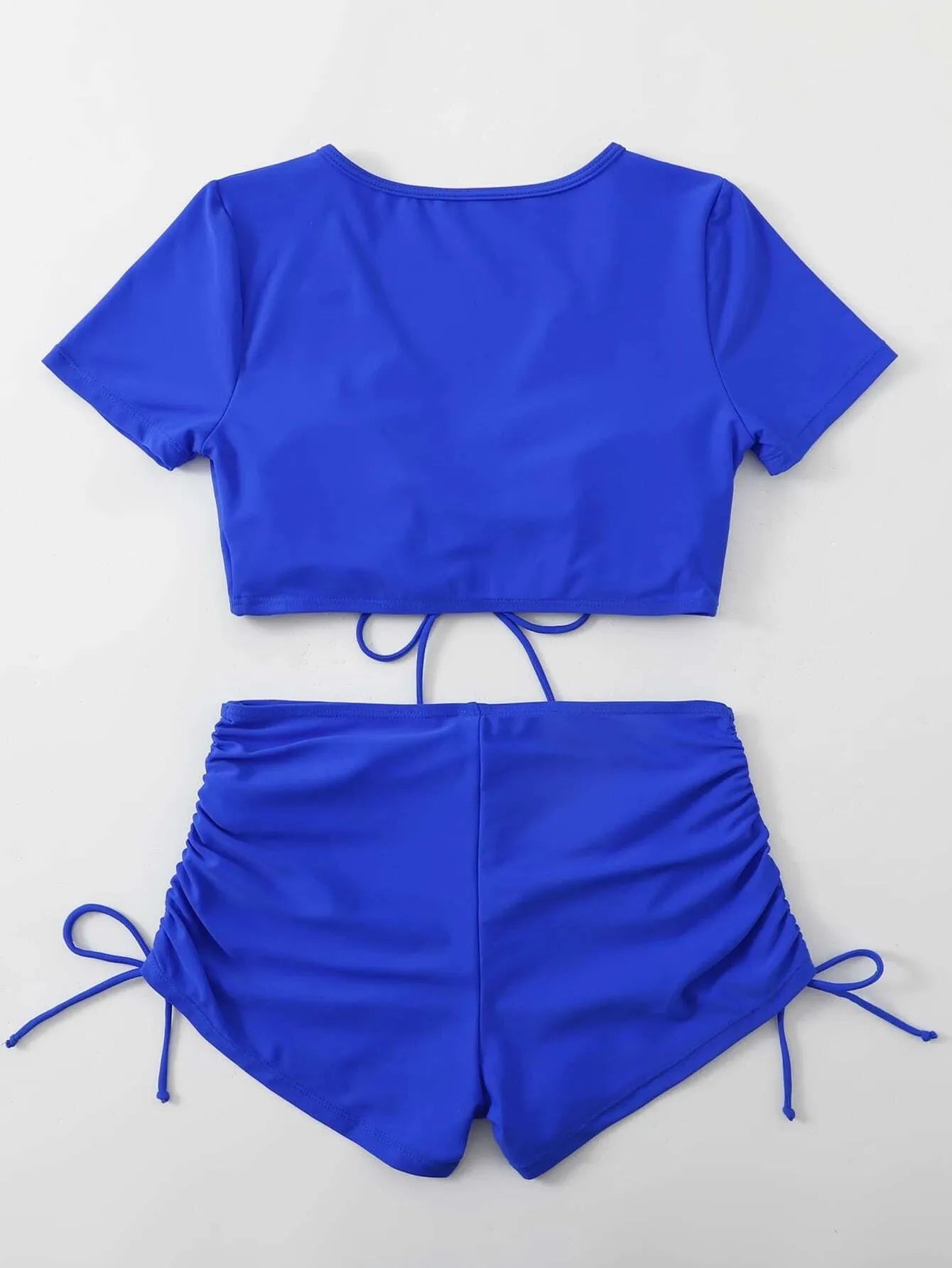 Women's lace-up bow two-piece swimsuit set in black, showing top and shorts