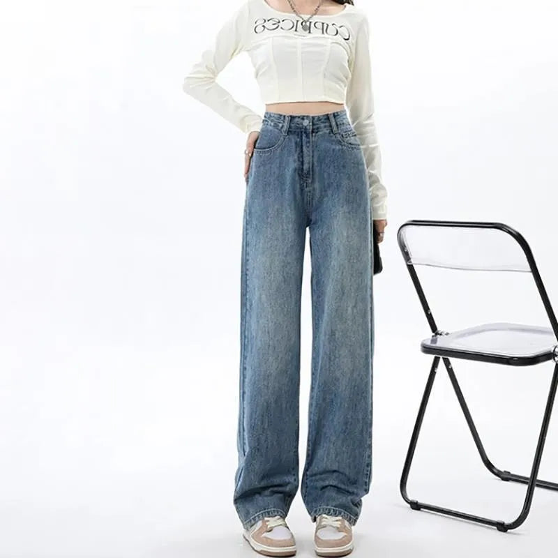 Women's retro blue high-waist wide-leg jeans laid flat, showing straight leg cut and denim texture.