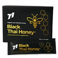 Glass jar of T1 Black Thai Honey showing dark colour with 1000g label