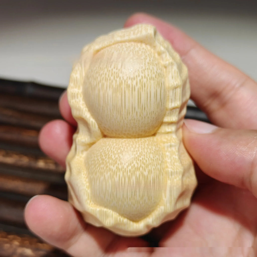 Solid bamboo peanut ornament carving with May Good Things Happen message